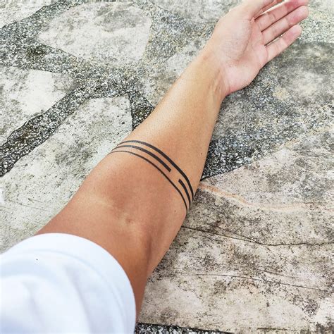 hand band tattoo|minimalist armband tattoo designs.